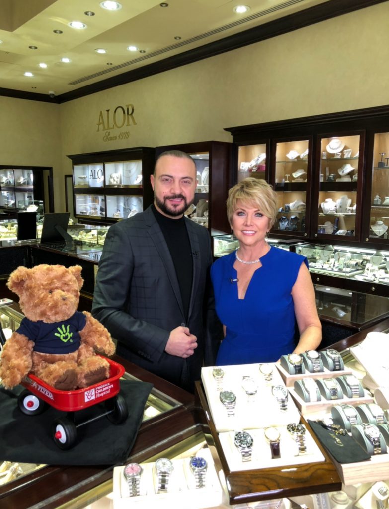 Frank Isaac with a guest at the watch counter