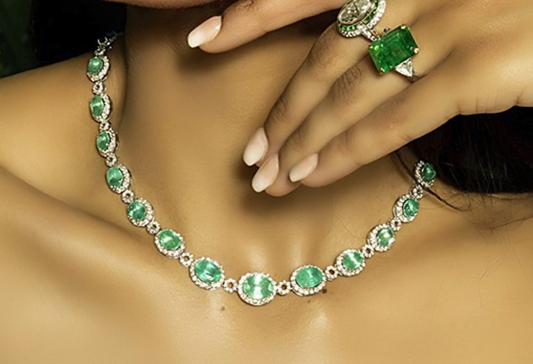Emerald and diamond necklace with an emerald-cut emerald ring