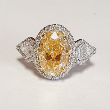 Lab-Grown Fancy Intense Yellow Oval Diamond Halo Ring, 6.85 ct tw